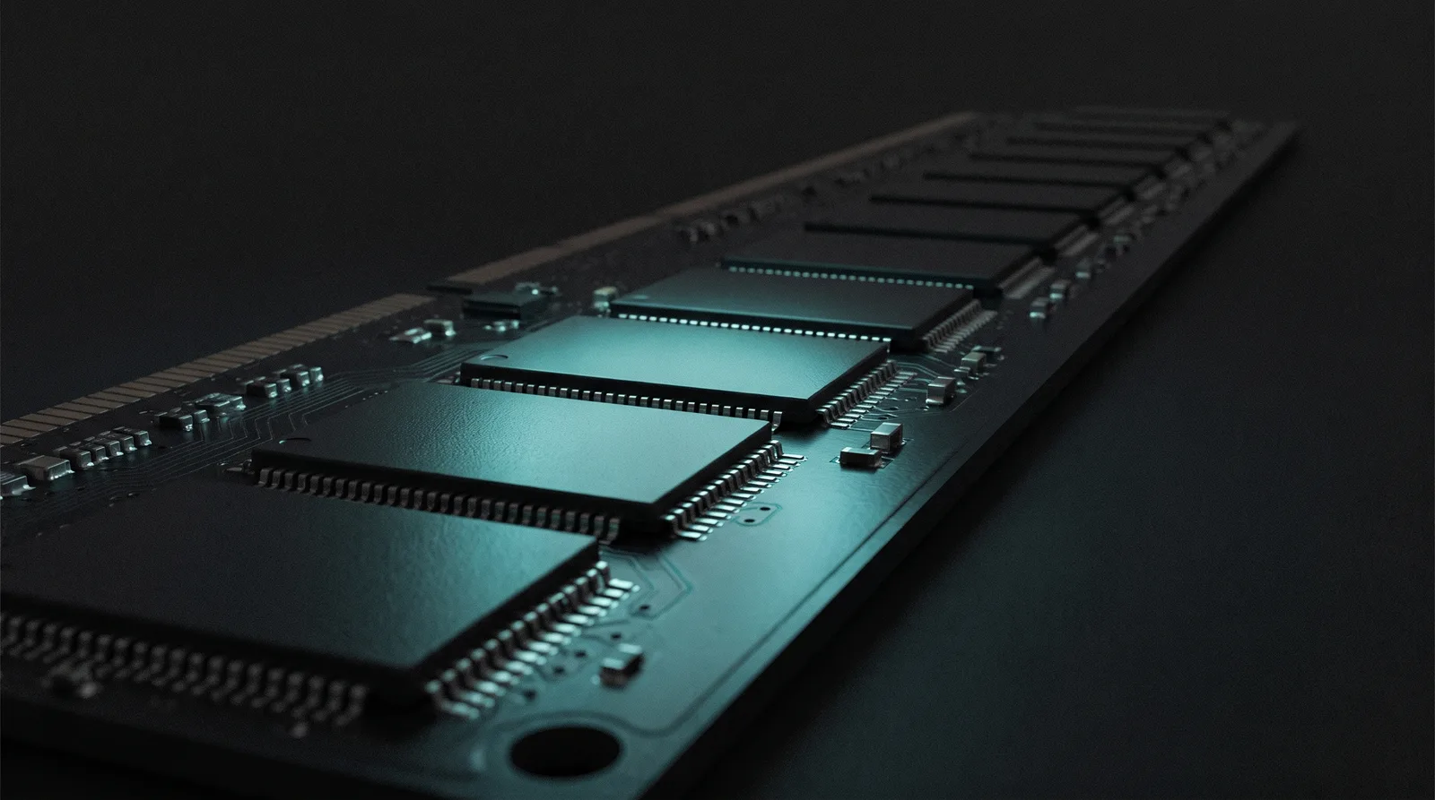 Close-up of memory chips on a dark circuit board, a few lit in cyan while the rest stay in shadow