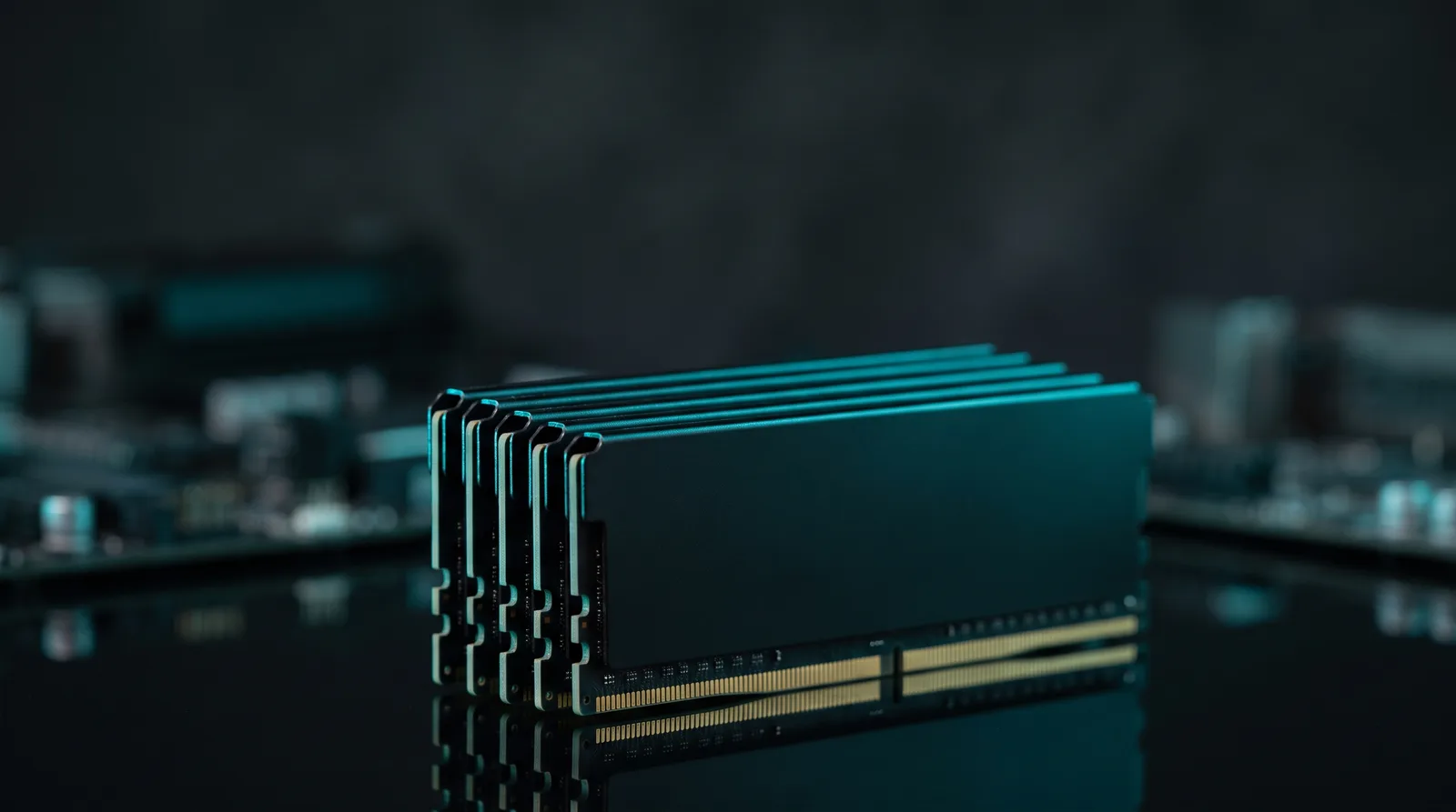 A stack of DDR5 desktop memory modules lit against a dark background, the component whose price nearly doubled in 2026